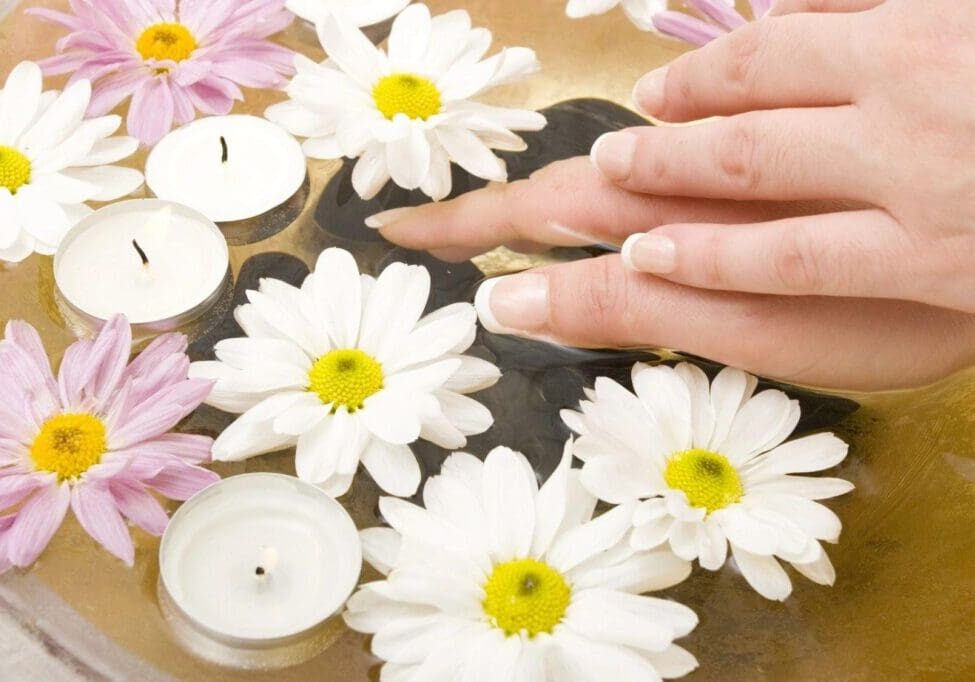 A person with their hands on top of the table